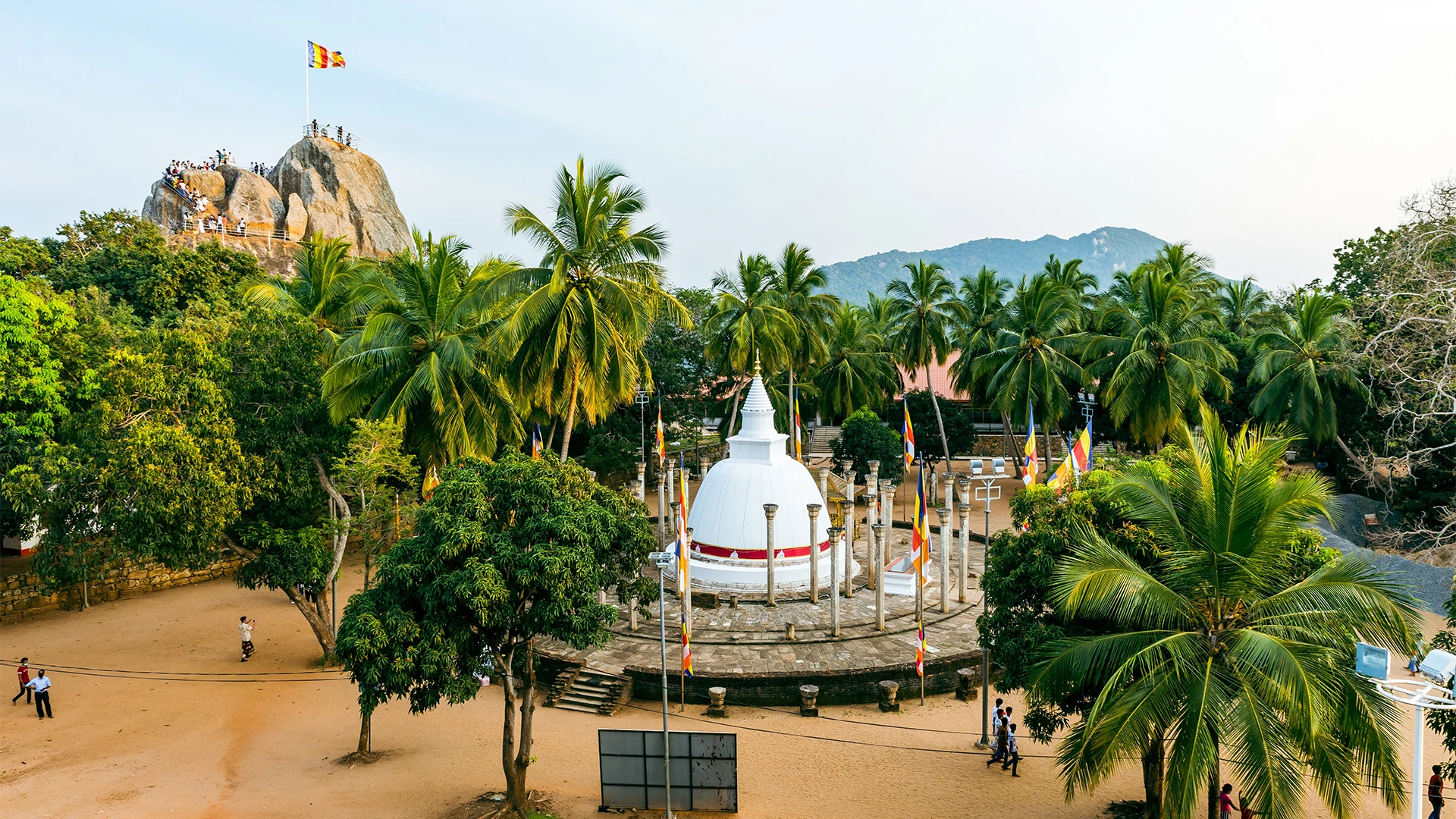 White stupa and Buddhist flags at Mihintale near Anuradhapura