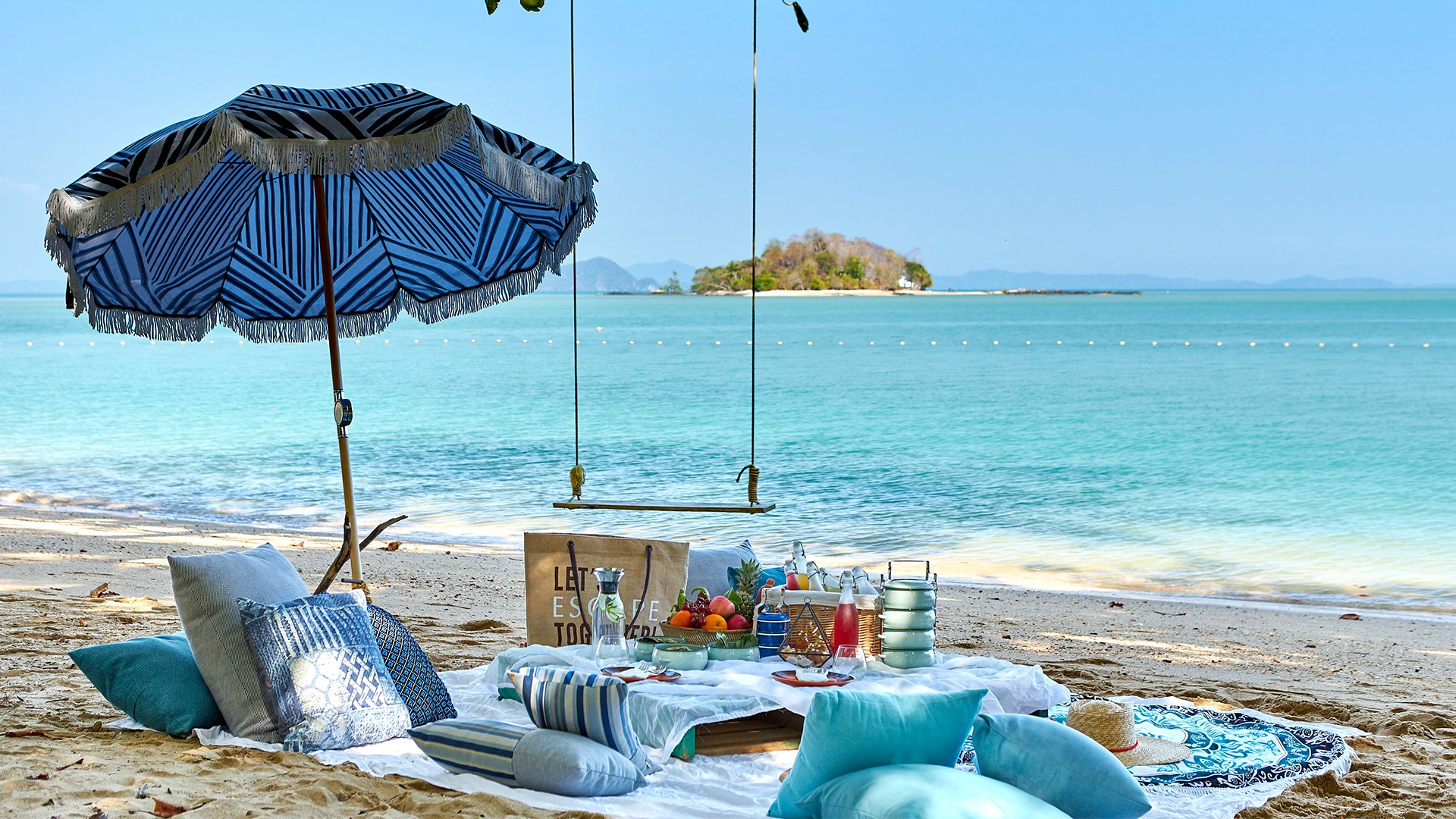Beach picnic setup at Island Escape by Burasari